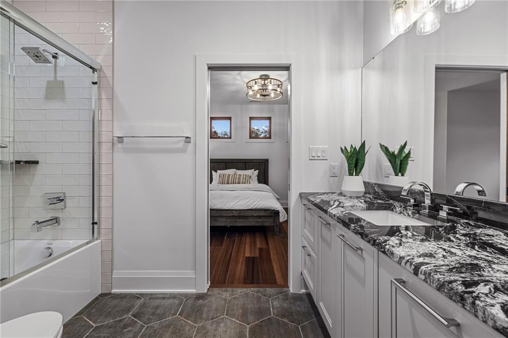 10485 Grubbs Road Wexford, PA 15090 - Photo 31 of 50 Upper Jack and Jill style bathroom with Rutt Cabinetry and Armina Stone Arabian Nights countertops.