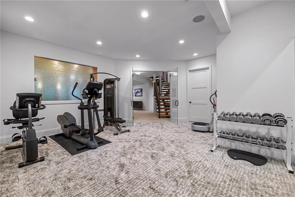 10485 Grubbs Road Wexford, PA 15090 - Photo 43 of 50 The exercise room features Custom glass French doors and a mirrored wall! One of the Two huge storage rooms is accessible from this room.