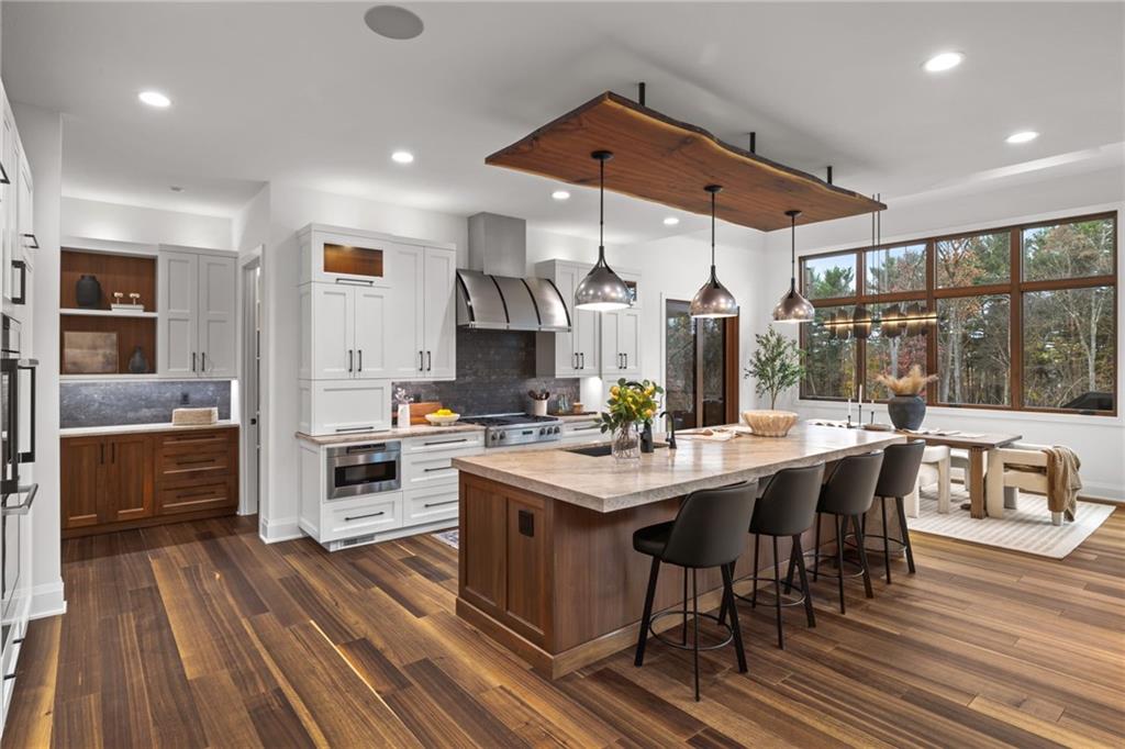 10485 Grubbs Road Wexford, PA 15090 - Photo 7 of 50 Cuvee kitchen with Rutt cabinetry with walnut accents and custom lighting detail. Gorgeous Armina Stone, Allure Leather Quartzite countertops.
