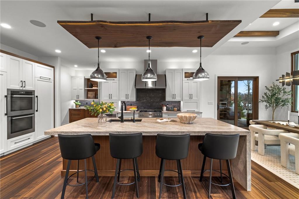 10485 Grubbs Road Wexford, PA 15090 - Photo 8 of 50 Custom designed live edge wood mount for pendants over the custom island