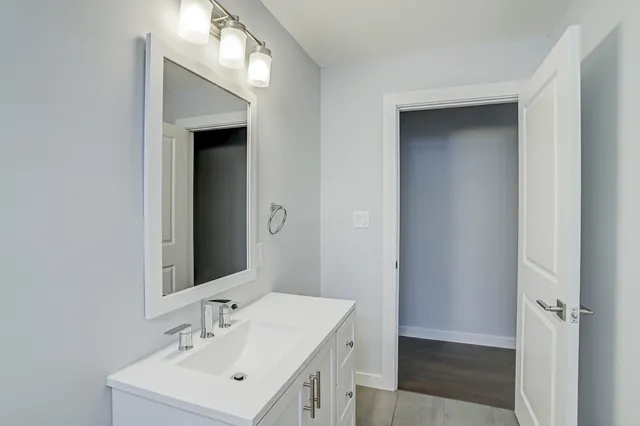 a bathroom with a sink and a mirror