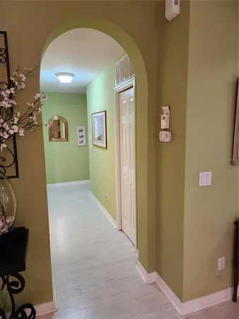a view of a livingroom with workspace and a window