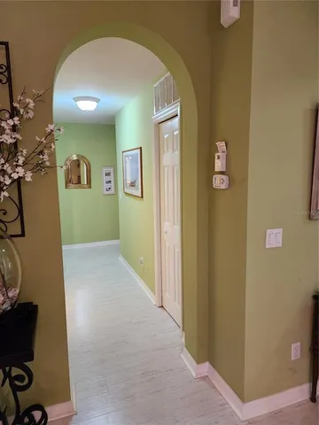 a view of a livingroom with workspace and a window