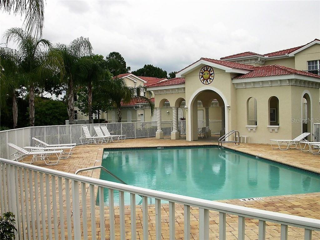 400 Ravinia Circle, Unit 400 Venice, FL 34292 - Photo 28 of 31 a view of a house with a swimming pool