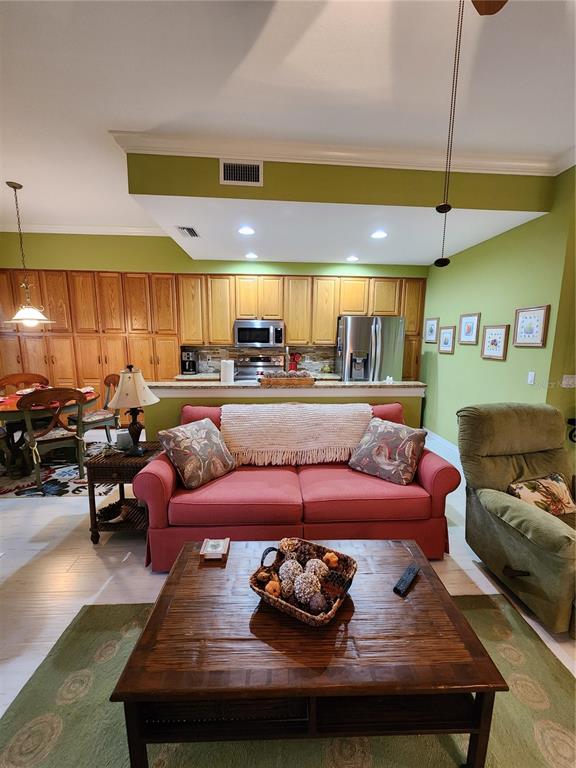 400 Ravinia Circle, Unit 400 Venice, FL 34292 - Photo 4 of 31 a living room with furniture and a table