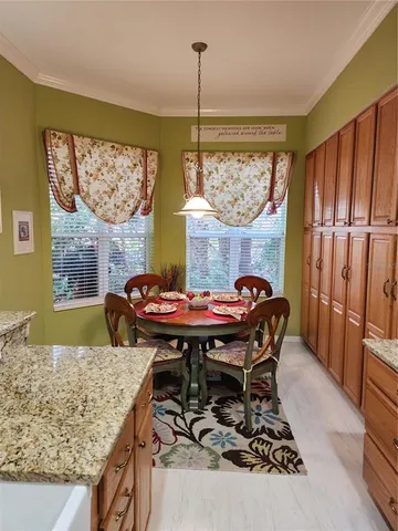 a dining room with furniture and window