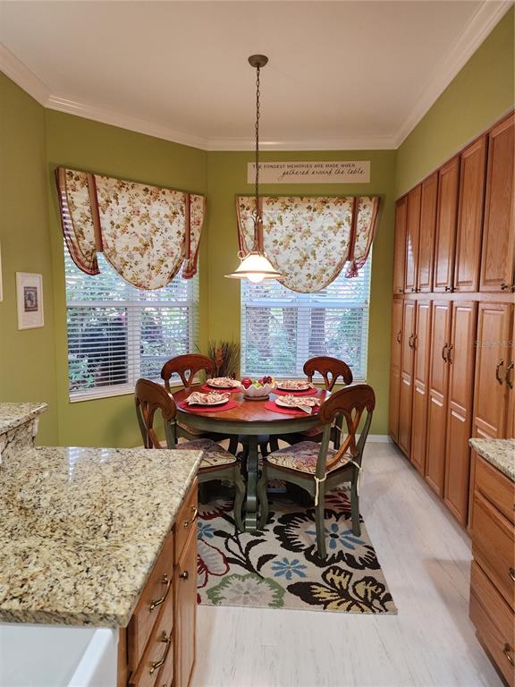 400 Ravinia Circle, Unit 400 Venice, FL 34292 - Photo 7 of 31 a dining room with furniture and window