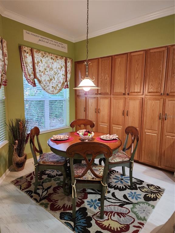 400 Ravinia Circle, Unit 400 Venice, FL 34292 - Photo 8 of 31 a view of a dining room with furniture window and outside view