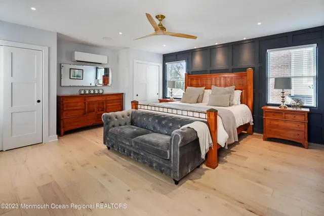 a spacious bedroom with a bed and window