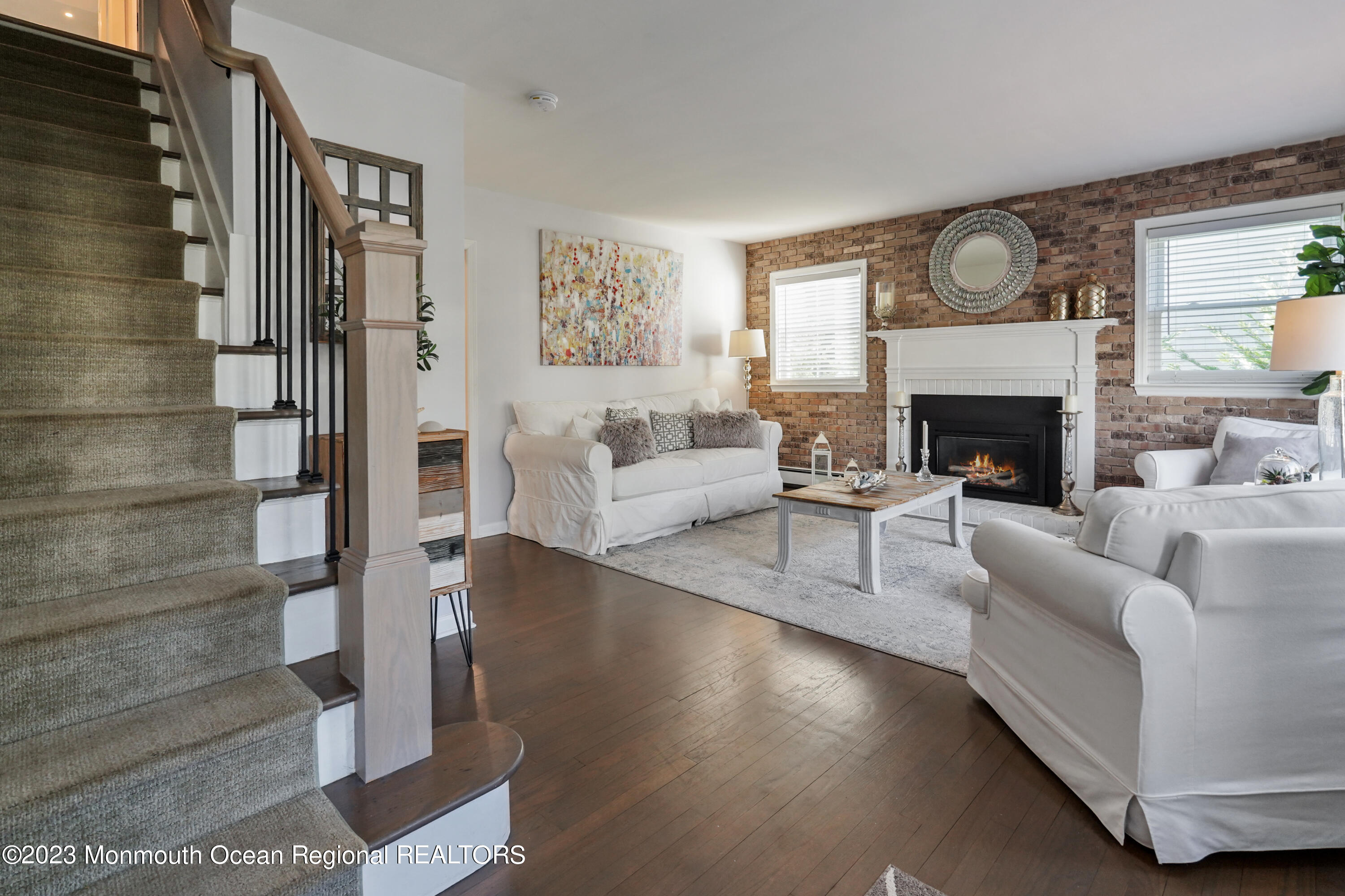 315 Ludlow Avenue Spring Lake, NJ 07762 - Photo 2 of 31 a living room with furniture and a fireplace