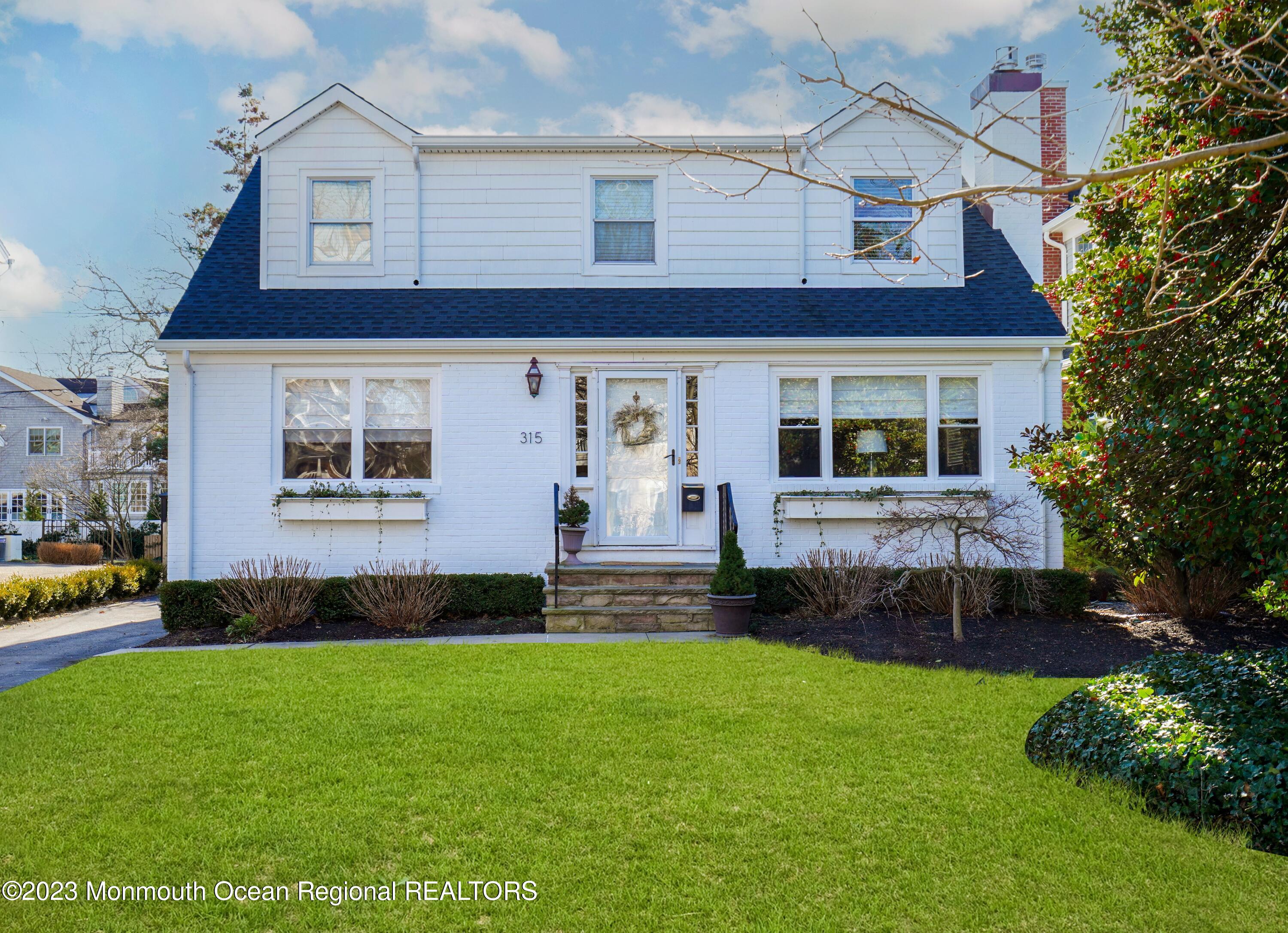 315 Ludlow Avenue Spring Lake, NJ 07762 - Photo 31 of 31 a front view of a house with a yard