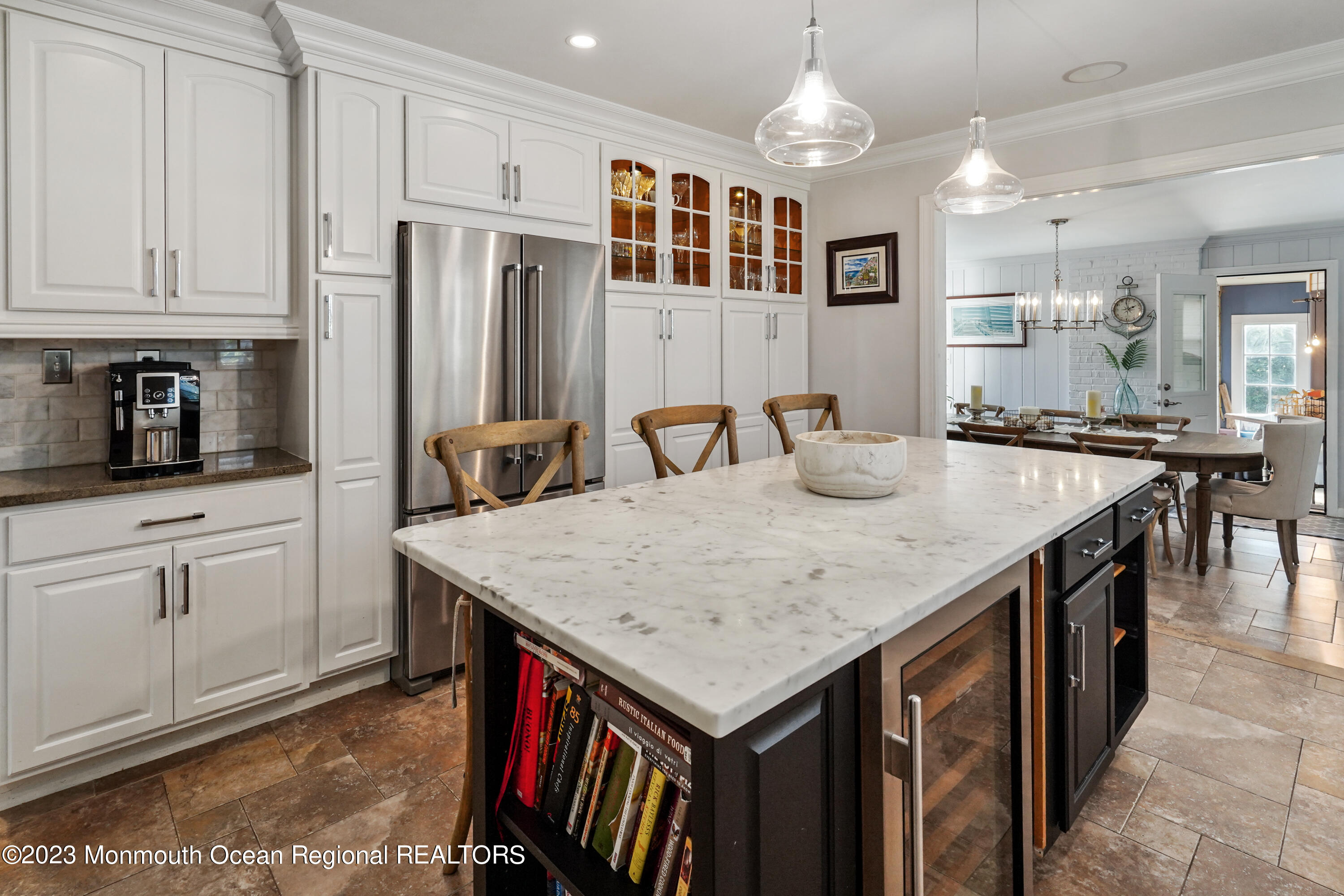 315 Ludlow Avenue Spring Lake, NJ 07762 - Photo 4 of 31 a kitchen with center island table and chairs