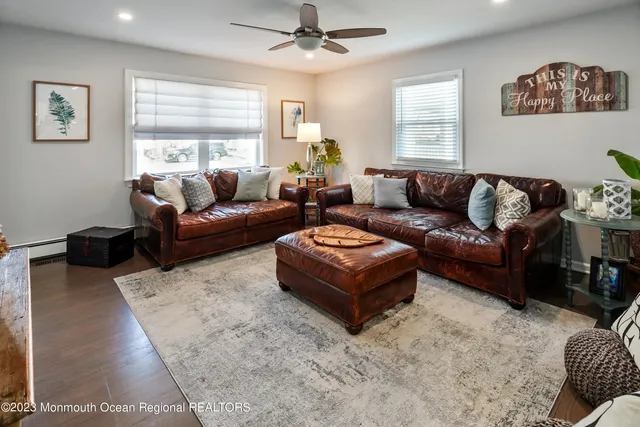 a living room with furniture a bed and a couch