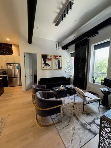 a view of a patio with chair and tables back yard of the house