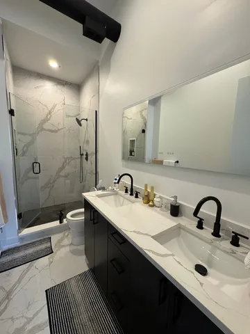 a bathroom with a sink and mirror