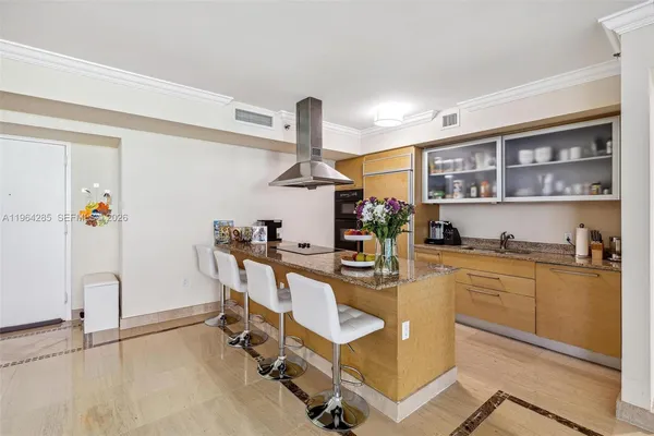 a kitchen with a sink appliances and cabinets