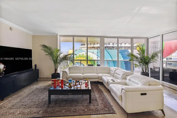 a living room with furniture fireplace and a flat screen tv