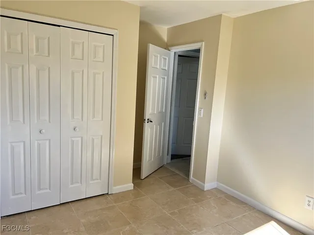 an empty room with a wooden door