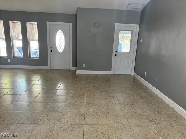 an empty room with mirror