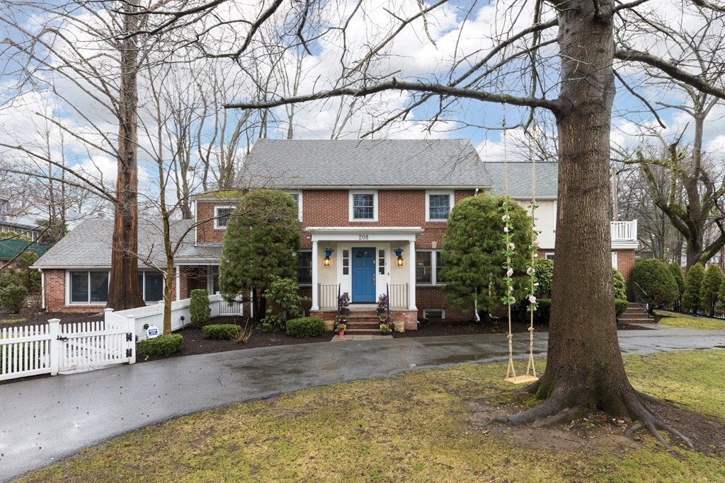 208 South Street Brookline, MA 02467 - Photo 1 of 30 a front view of a house with a tree in front