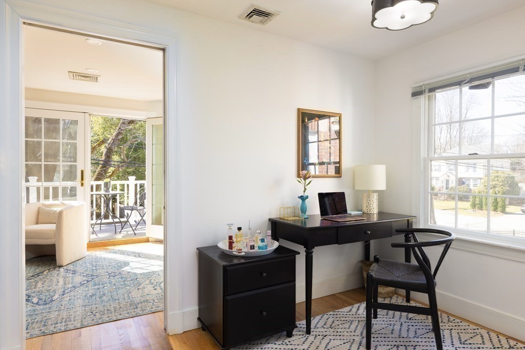 208 South Street Brookline, MA 02467 - Photo 15 of 30 a view of a workspace with furniture and a window
