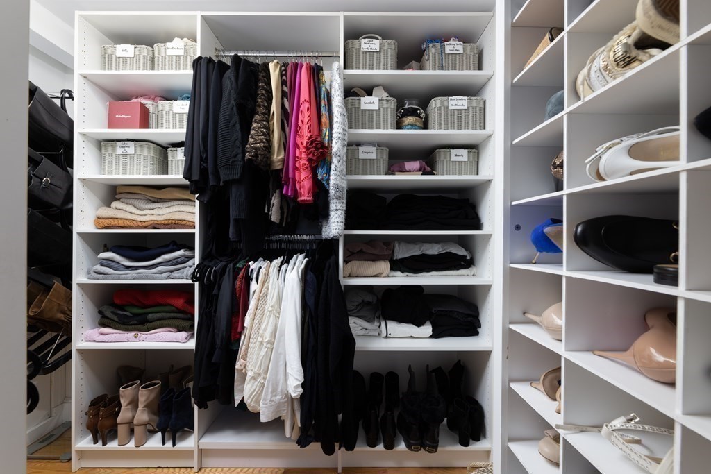 208 South Street Brookline, MA 02467 - Photo 16 of 30 a view of walk in closet with clothes and shoes