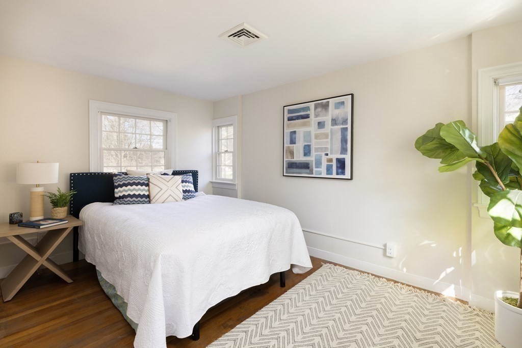 208 South Street Brookline, MA 02467 - Photo 18 of 30 a large bedroom with bed and a window