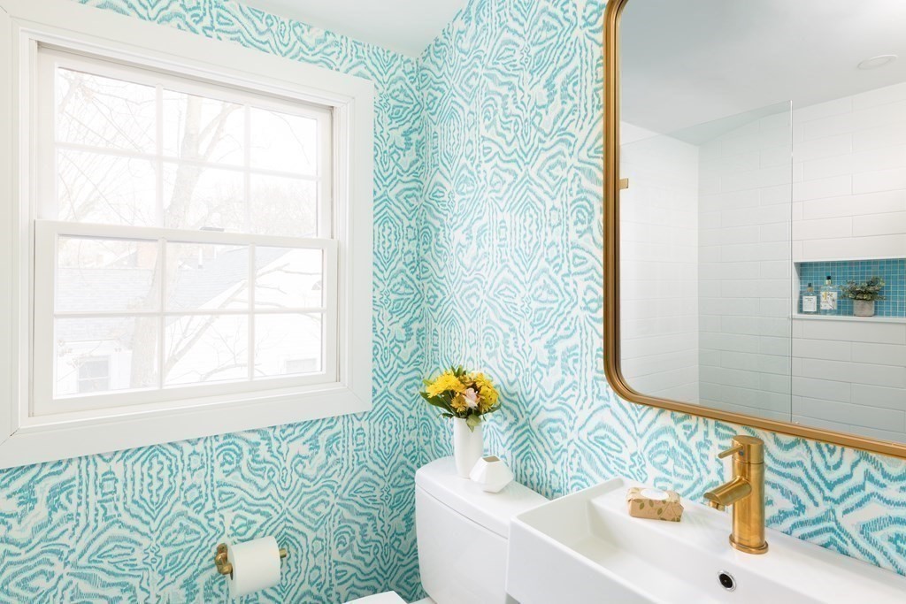 208 South Street Brookline, MA 02467 - Photo 21 of 30 a bathroom with a sink and a mirror