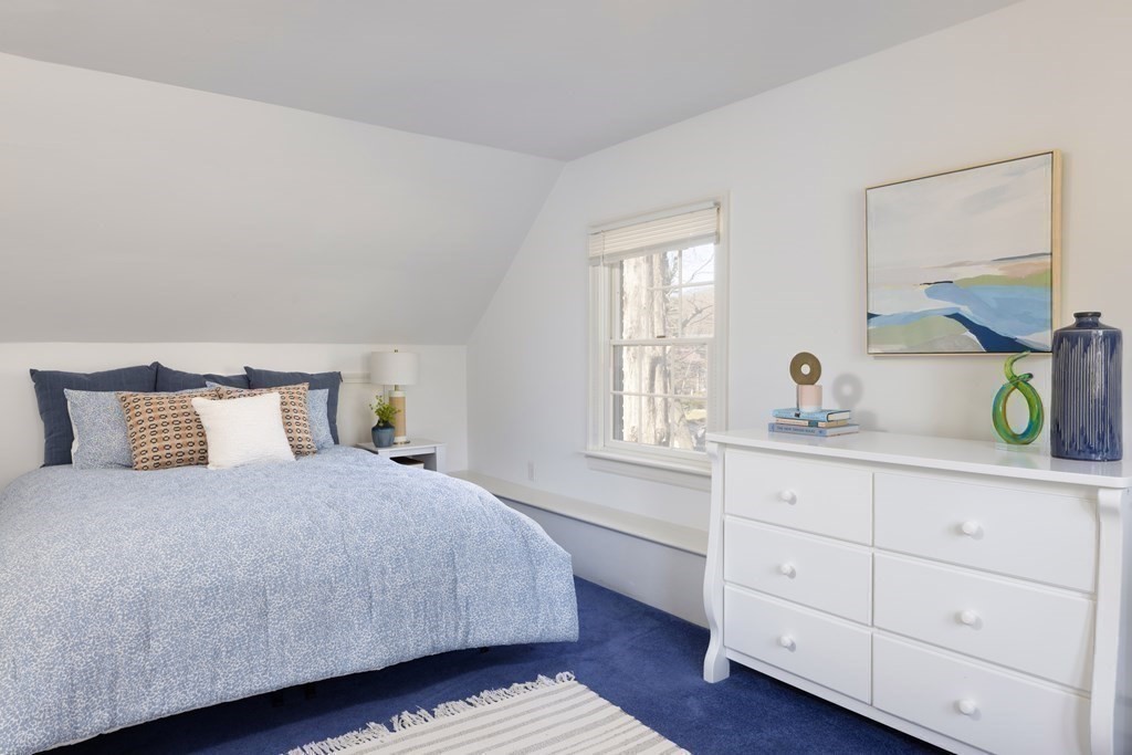 208 South Street Brookline, MA 02467 - Photo 22 of 30 a bedroom with a bed and a dresser