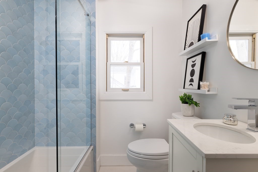 208 South Street Brookline, MA 02467 - Photo 24 of 30 a bathroom with a toilet a sink and a bathtub