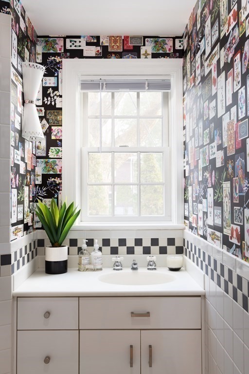 208 South Street Brookline, MA 02467 - Photo 26 of 30 a bathroom with a sink a mirror and a bathtub