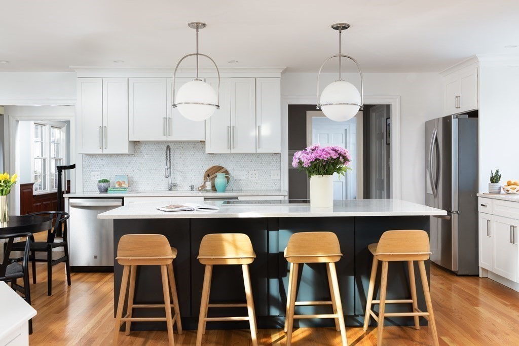 208 South Street Brookline, MA 02467 - Photo 3 of 30 a kitchen with cabinets and chairs