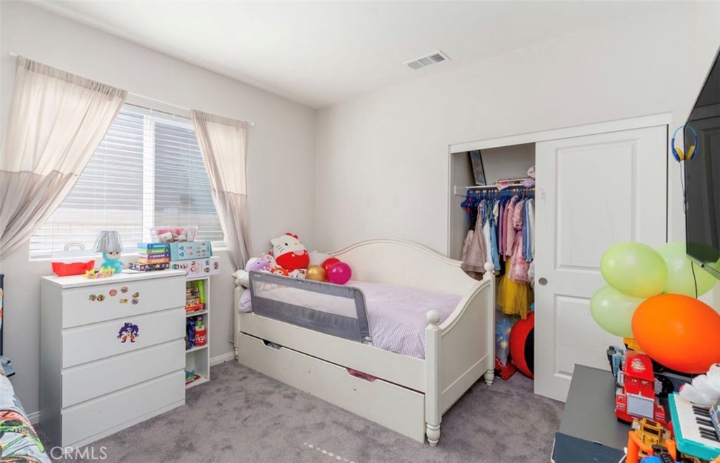 455 East Orchard Street Rialto, CA 92376 - Photo 11 of 22 a room that has a bed and a window