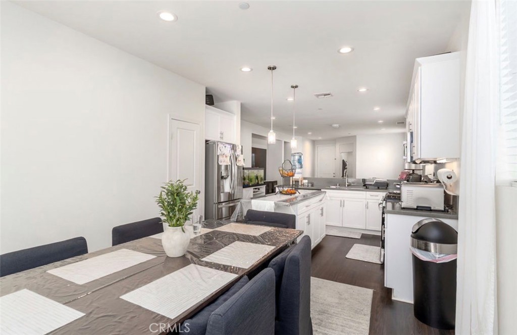 455 East Orchard Street Rialto, CA 92376 - Photo 13 of 22 a living room with kitchen island furniture and a dining table