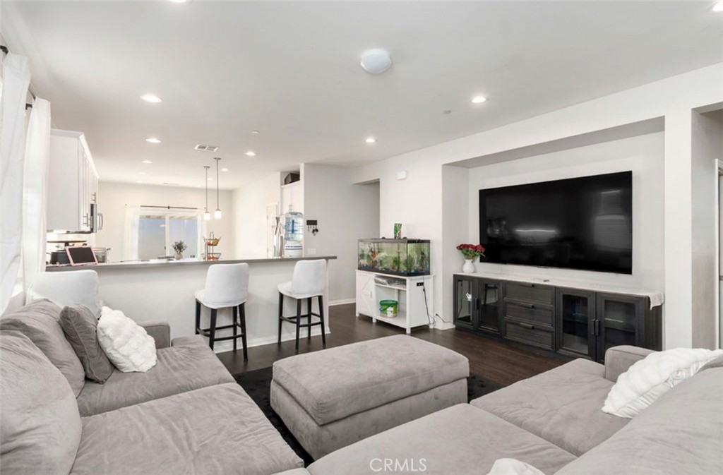 455 East Orchard Street Rialto, CA 92376 - Photo 16 of 22 a living room with furniture and a flat screen tv