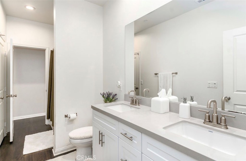 455 East Orchard Street Rialto, CA 92376 - Photo 18 of 22 a bathroom with a double vanity sink toilet and shower