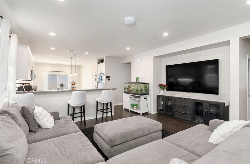 455 East Orchard Street Rialto, CA 92376 - Photo 19 of 22 a living room with furniture and a flat screen tv