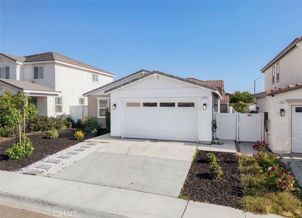 455 East Orchard Street Rialto, CA 92376 - Photo 2 of 22 a front view of a house with a yard