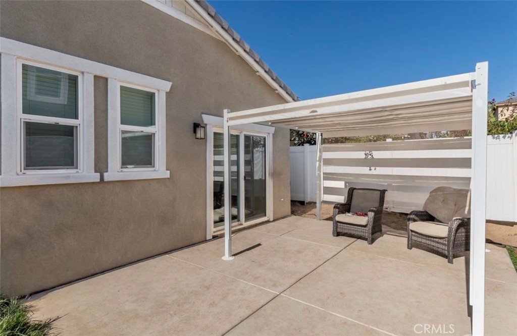 455 East Orchard Street Rialto, CA 92376 - Photo 6 of 22 a view of a house with backyard and glass windows