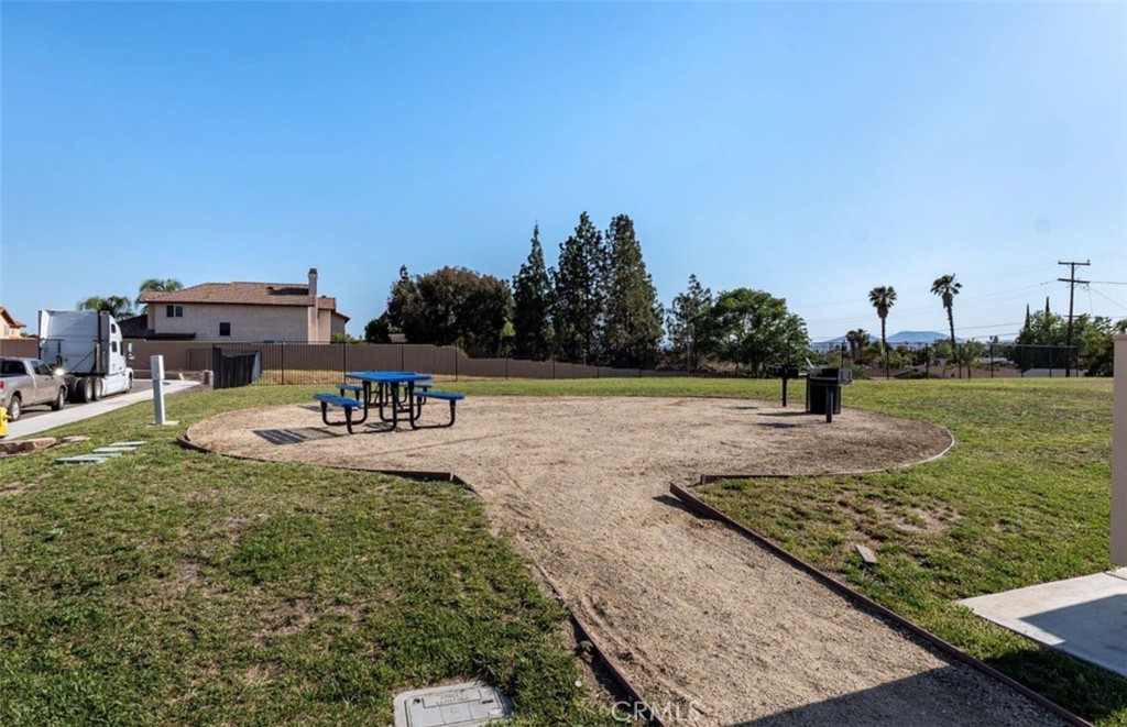 455 East Orchard Street Rialto, CA 92376 - Photo 8 of 22 a view of a swimming pool with a yard