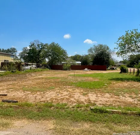 a view of a water fountain and a big yard