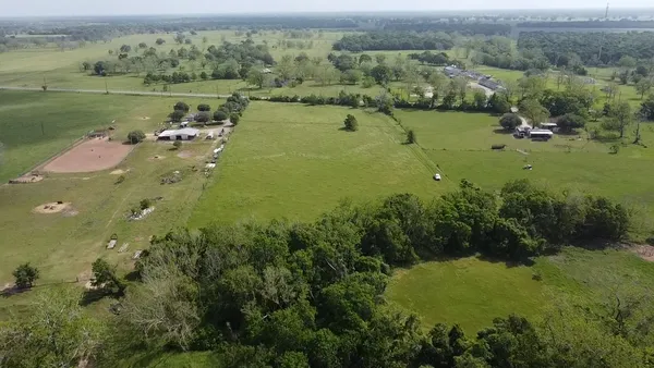 a backyard of a house with lots of green space