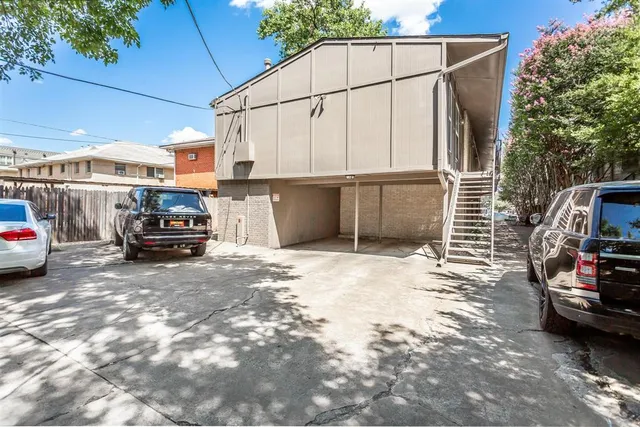 a car parked in front of a house