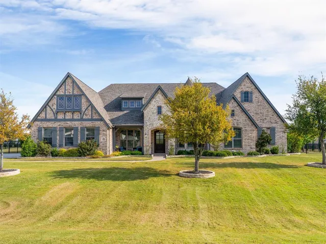 a front view of the house with a yard