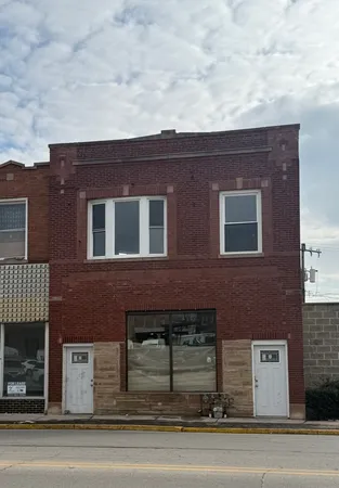 a front view of a house with garage