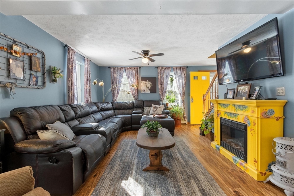 112 Baldwinville State Road Winchendon, MA 01475 - Photo 12 of 42 a living room with furniture and a flat screen tv