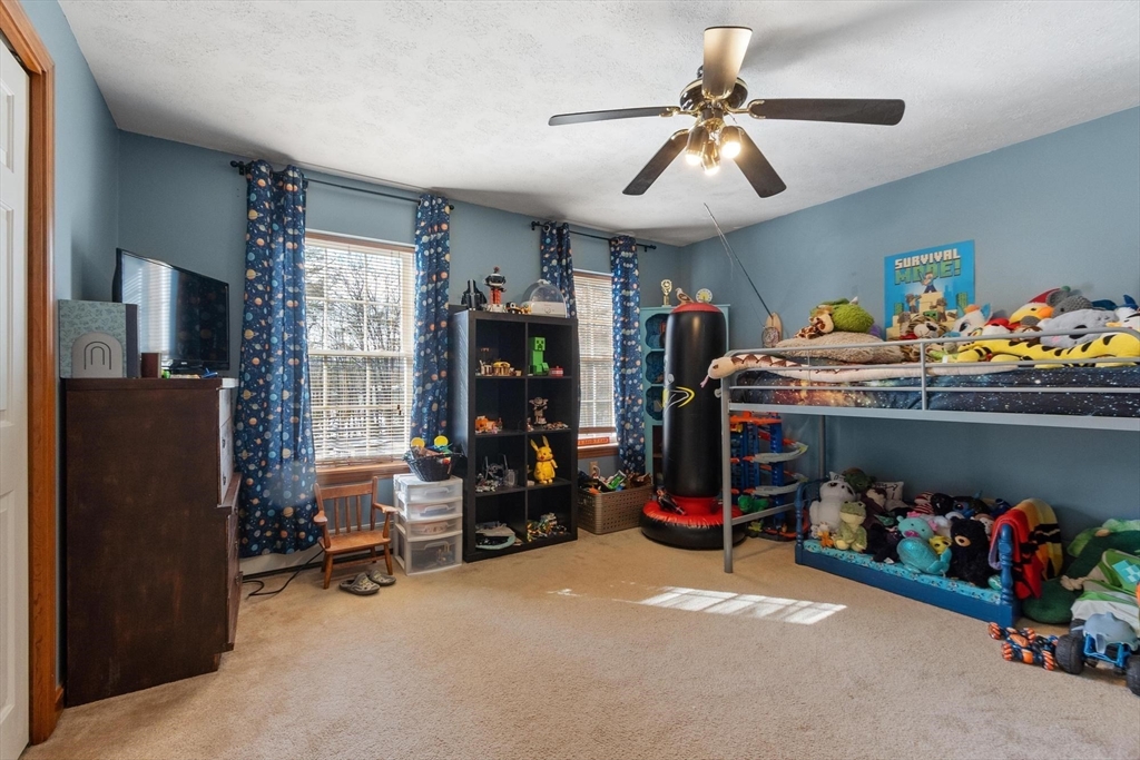 112 Baldwinville State Road Winchendon, MA 01475 - Photo 19 of 42 a bed room with furniture and a chandelier