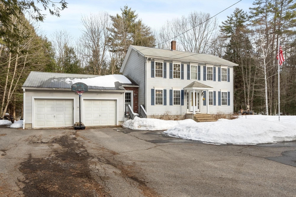 112 Baldwinville State Road Winchendon, MA 01475 - Photo 2 of 42 a front view of a house with a yard and garage