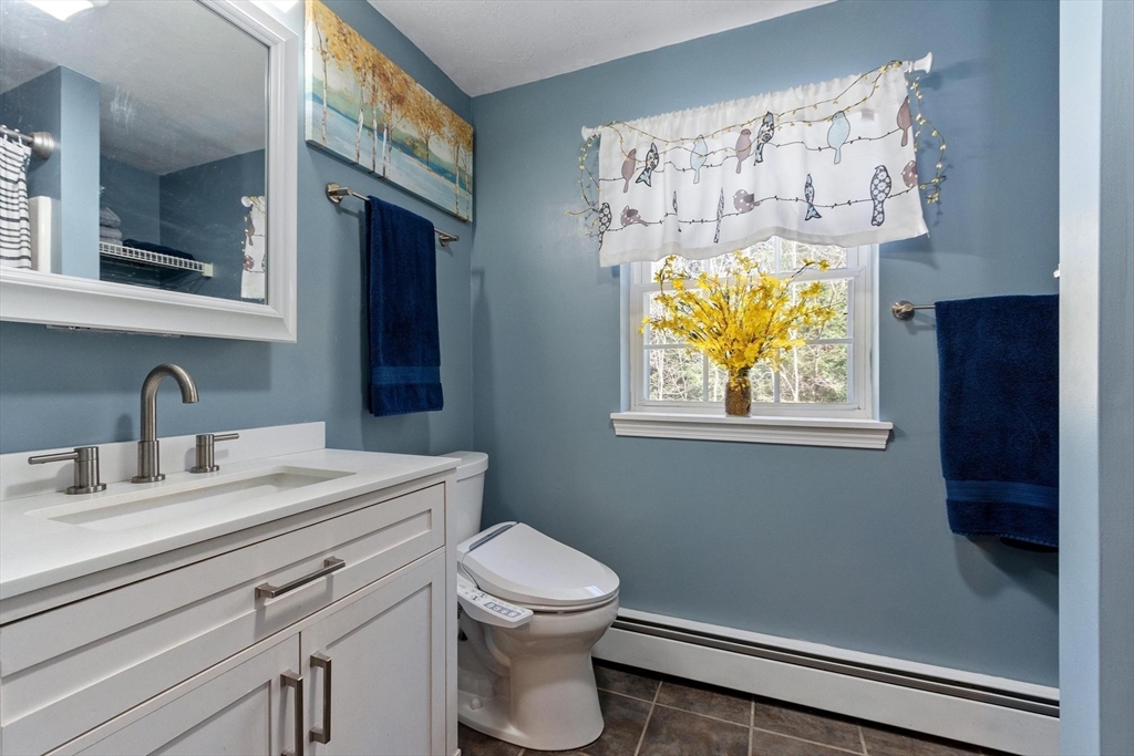 112 Baldwinville State Road Winchendon, MA 01475 - Photo 23 of 42 a bathroom with a toilet a sink and mirror