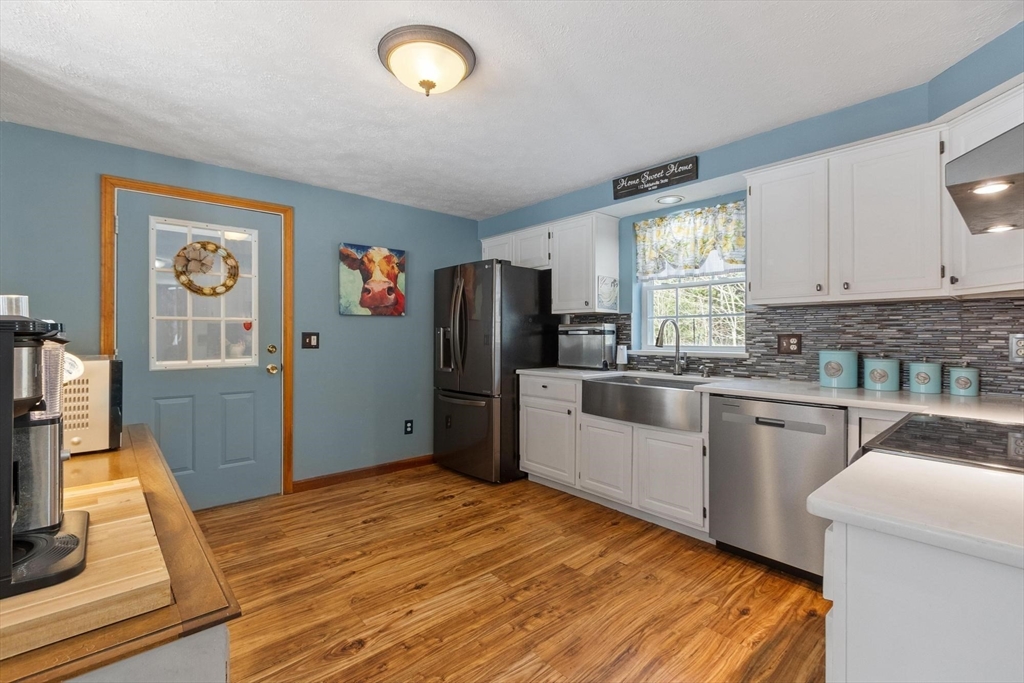 112 Baldwinville State Road Winchendon, MA 01475 - Photo 5 of 42 a kitchen with stainless steel appliances granite countertop a refrigerator and a stove top oven